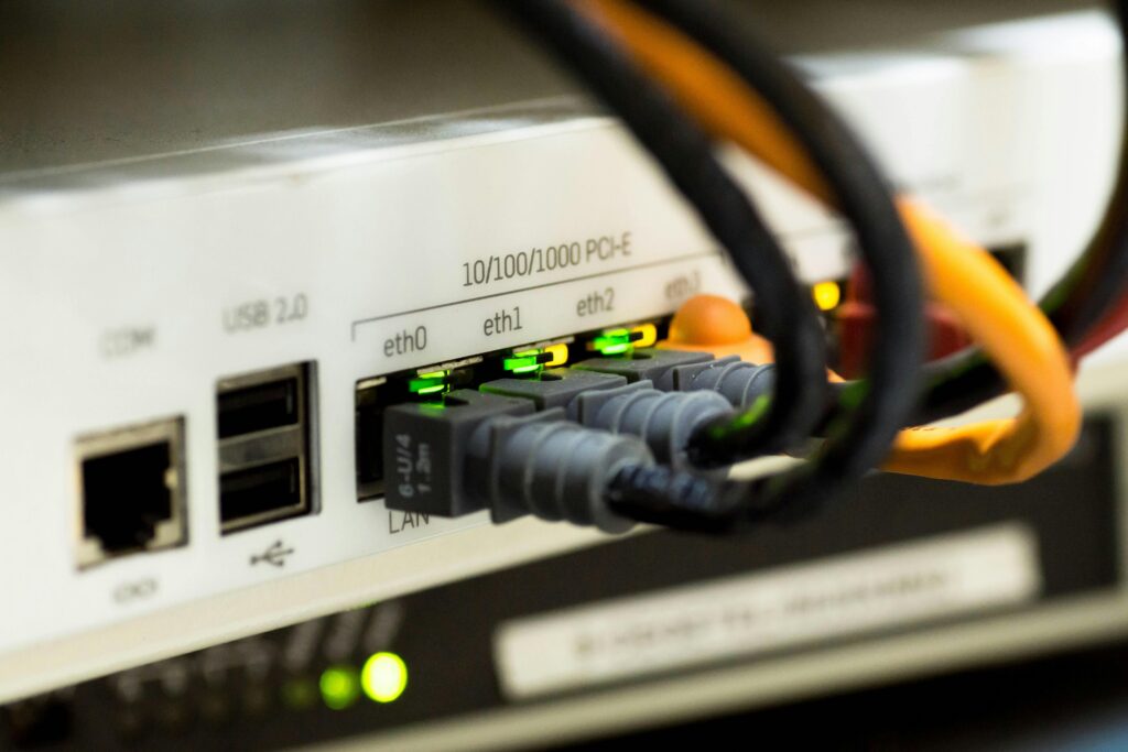 network-cable-ethernet-computer-159304-159304 Detailed close-up of ethernet cables and network connections on a router, showcasing modern technology.