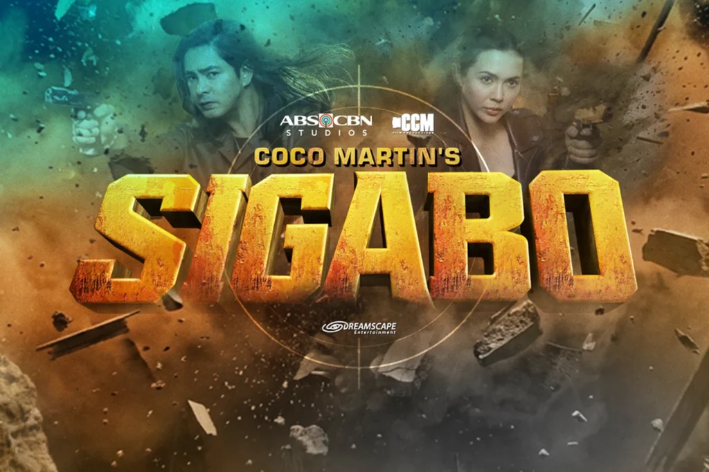 Promotional movie poster showing two action heroes with guns amid debris, centered by large bold yellow 3D title text and studio logos above and below.